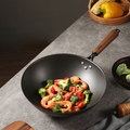 ShouYi Chinese wok filled with shrimp and vegetables, showcasing its natural non-stick surface and deep cooking capacity.