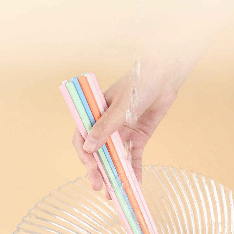 Quick-rinse PET fiber chopsticks being washed under water, highlighting easy 5-second cleaning for family kitchen convenience.