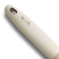 Close-up of ergonomic beige handle with Zhang Xiaoquan branding on 3-in-1 bottle opener. Comfortable grip for kitchen and bar use.