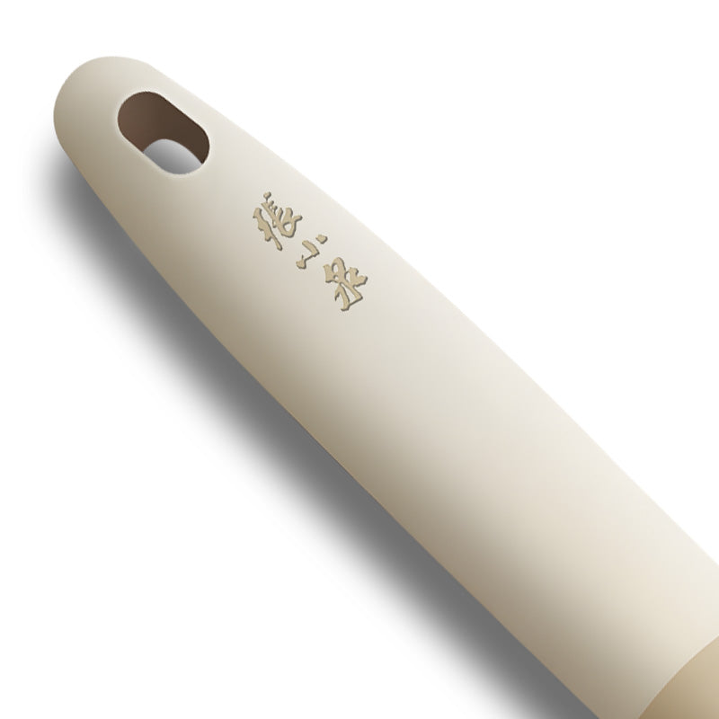 Close-up of ergonomic beige handle with Zhang Xiaoquan branding on 3-in-1 bottle opener. Comfortable grip for kitchen and bar use.