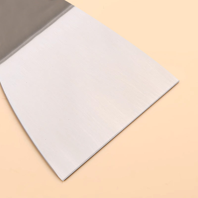 Detail view of the polished 430 stainless steel blade of the multi-purpose cooking spatula, highlighting its smooth finish.