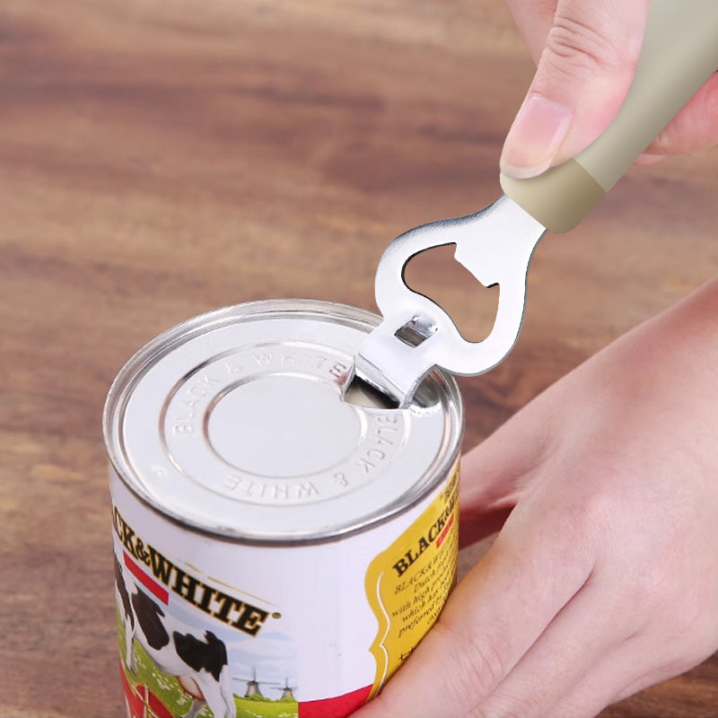 Multifunctional bottle opener used to lift can lid. Versatile kitchen tool for opening cans, bottles, and formula containers.