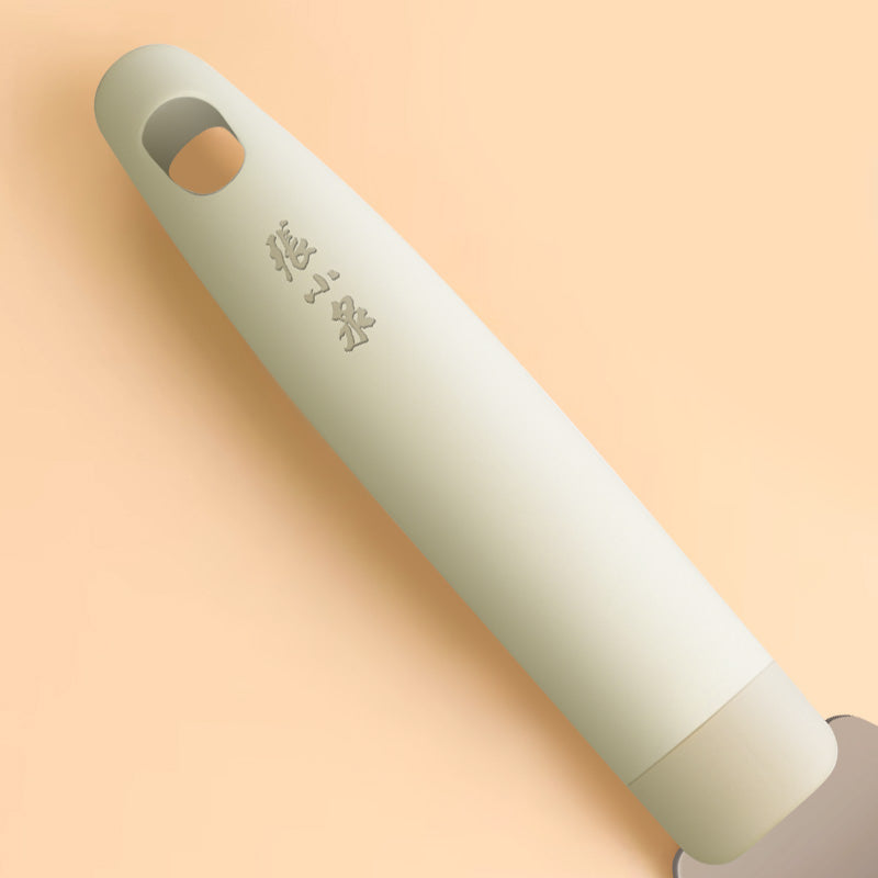 Close-up of the ergonomic handle of the 225mm stainless steel spatula with engraved Zhang Xiaoquan branding and hanging hole.