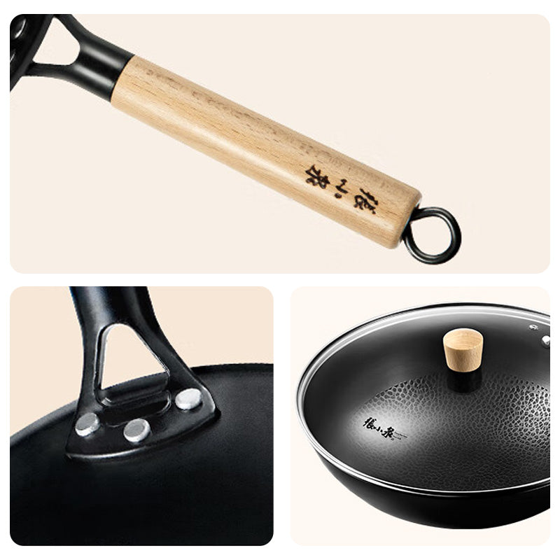 Close-up of Zhang Xiaoquan AU iron wok details including riveted handle, wooden grip, and glass lid with wooden knob.