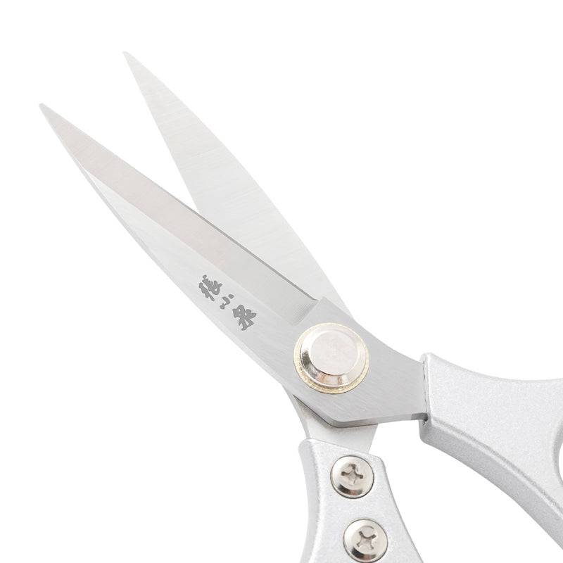 Close-up of 40Cr13 stainless steel blades on heavy duty kitchen scissors, showcasing riveted joint and durable construction for cutting poultry and seafood.