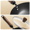 Close-up of 20cm coating-free wok with ergonomic wooden handle and tempered glass lid for safe, one-handed cooking.