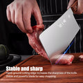 Heavy-duty 310mm meat cleaver slicing through ribs, emphasizing stable and sharp hand-ground edge for efficient bone chopping performance.