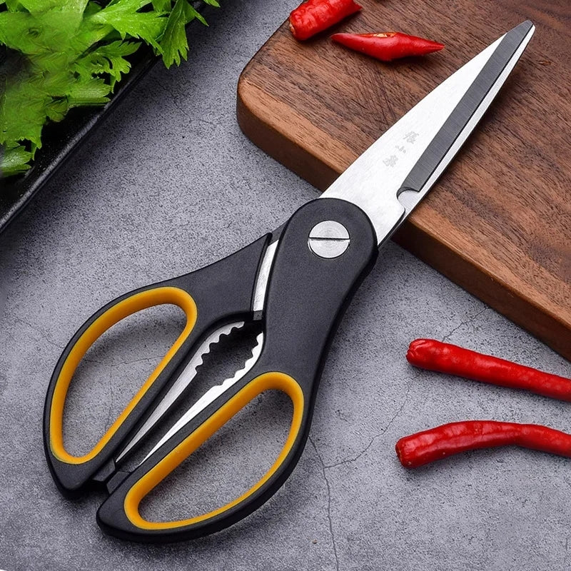 4-in-1 heavy duty kitchen scissors on a cutting board with chili peppers and herbs. Ideal for cutting vegetables, fish, and more in kitchen prep.