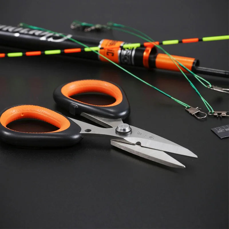 Zhang Xiaoquan AU 110mm stainless steel fishing scissors cutting green fishing line, ideal for saltwater use and fly tying applications.