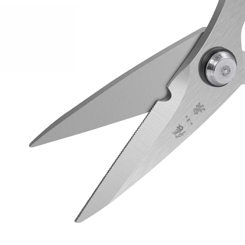 Close-up of serrated 50Cr15MoV steel blades on 110mm rust-proof fishing scissors, designed for precise line cutting in outdoor fishing.