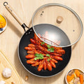 34cm nitrided iron wok with glass lid from Zhang Xiaoquan AU, showcasing cooked crayfish and hammered non-stick surface.