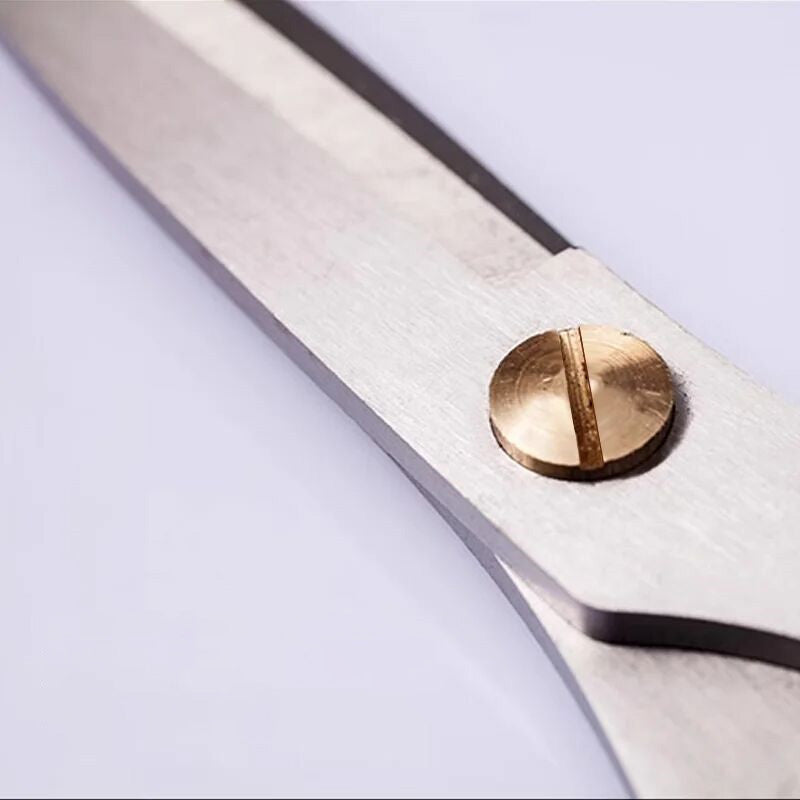 Close-up of the 185mm 30Cr13 Multi-Purpose Scissors' adjustable brass screw joint for tension control and long-lasting performance.