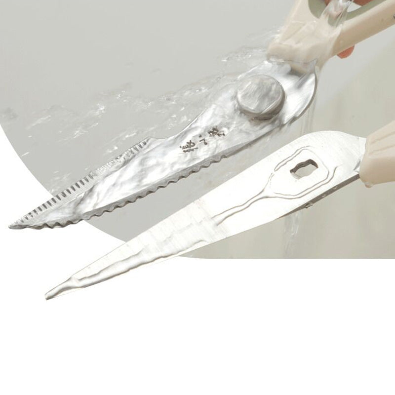 Detachable 30Cr13 steel blades of multipurpose kitchen scissors being washed under water, highlighting easy cleaning and hygiene.