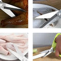 Kitchen scissors cutting various foods like chicken, fish, and vegetables.