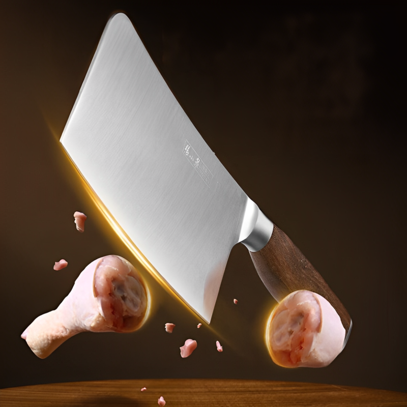 Sharp cleaver from the 50Cr15MoV steel kitchen knife set cutting through meat.