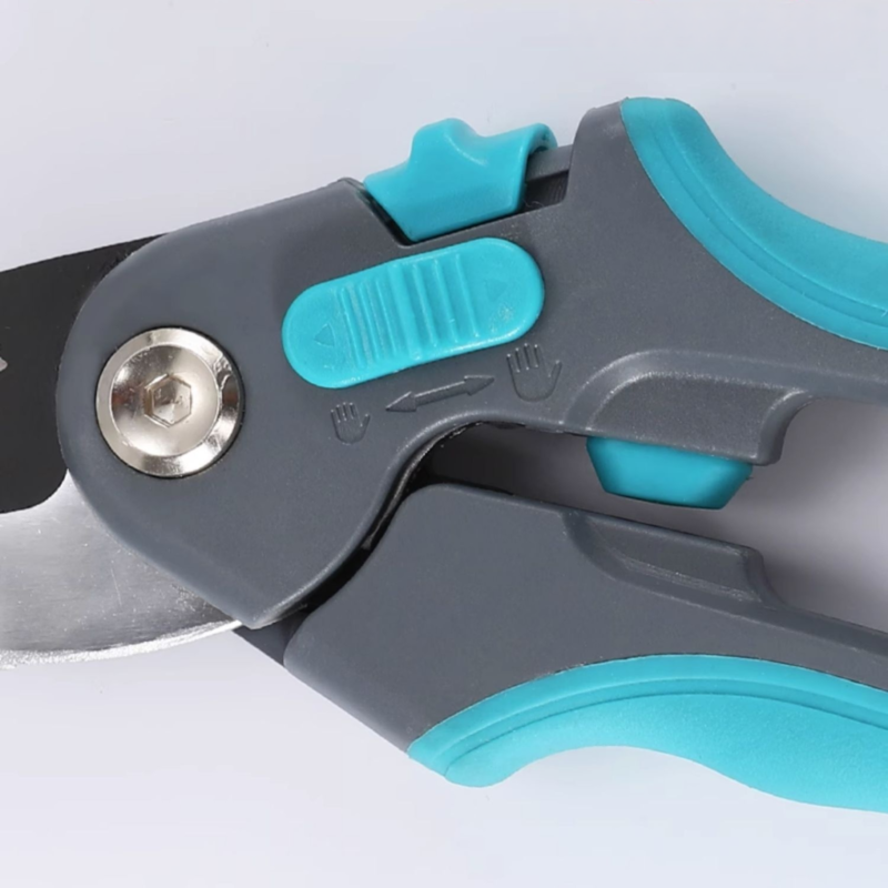 Close-up of pruning shears' locking mechanism and ergonomic grip.