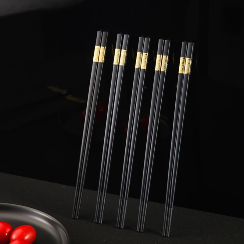 Set of 10 black PPS alloy chopsticks with golden accents, 240mm long.