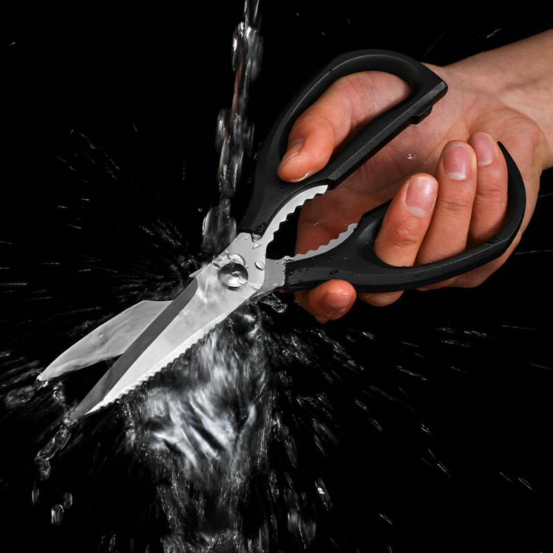 Water-resistant kitchen shears being rinsed under running water.