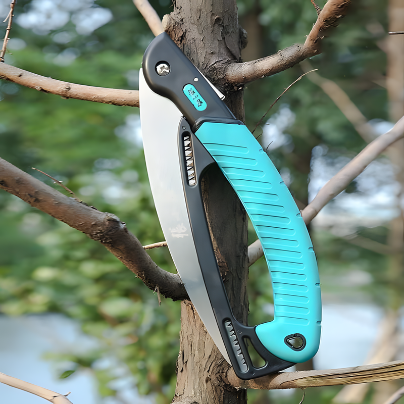 235mm 65Mn folding saw with a turquoise ergonomic handle, cutting through a tree branch. Heavy-duty garden tool for branches up to 50mm.