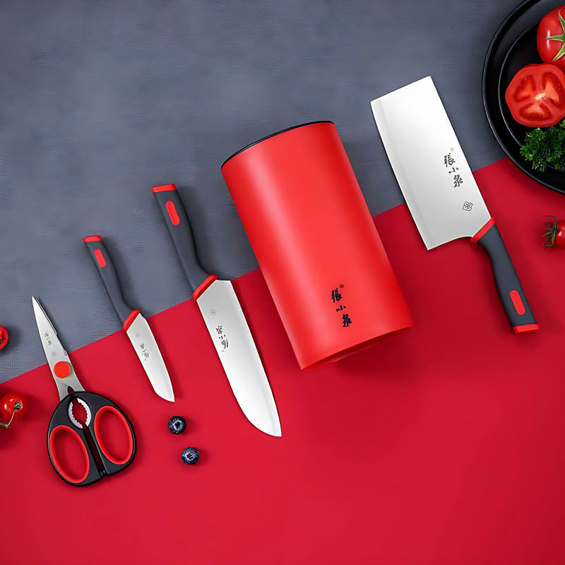 5-piece kitchen knife set with red ergonomic handles and storage base.