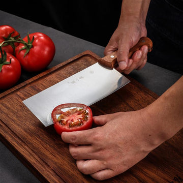 Zhang Xiaoquan 300mm 30Cr13 Chinese Cleaver slicing tomato on a wooden board, perfect for home chefs and kitchen enthusiasts.