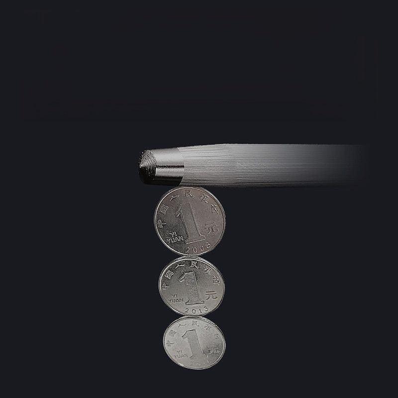 Sharpening rod tip shown with coins for size comparison and precision.