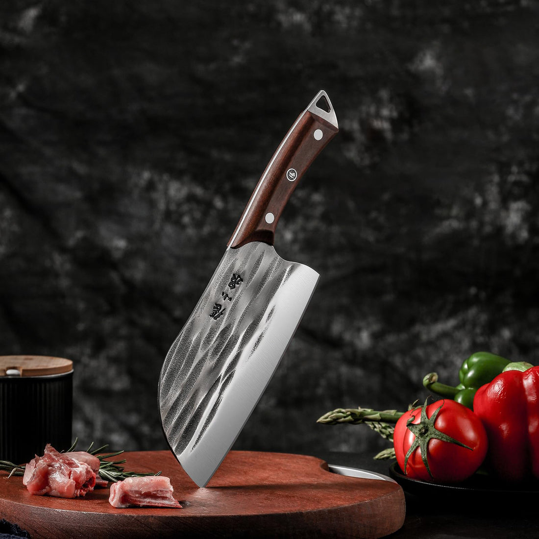 170mm 50Cr15MoV 1600°C hand-forged chopping knife with a wooden handle, displayed on a cutting board with fresh vegetables and meat.