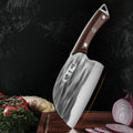 Close-up of a 50Cr15MoV hand-forged knife with a wooden handle and textured steel blade, displayed upright on a cutting board with vegetables.