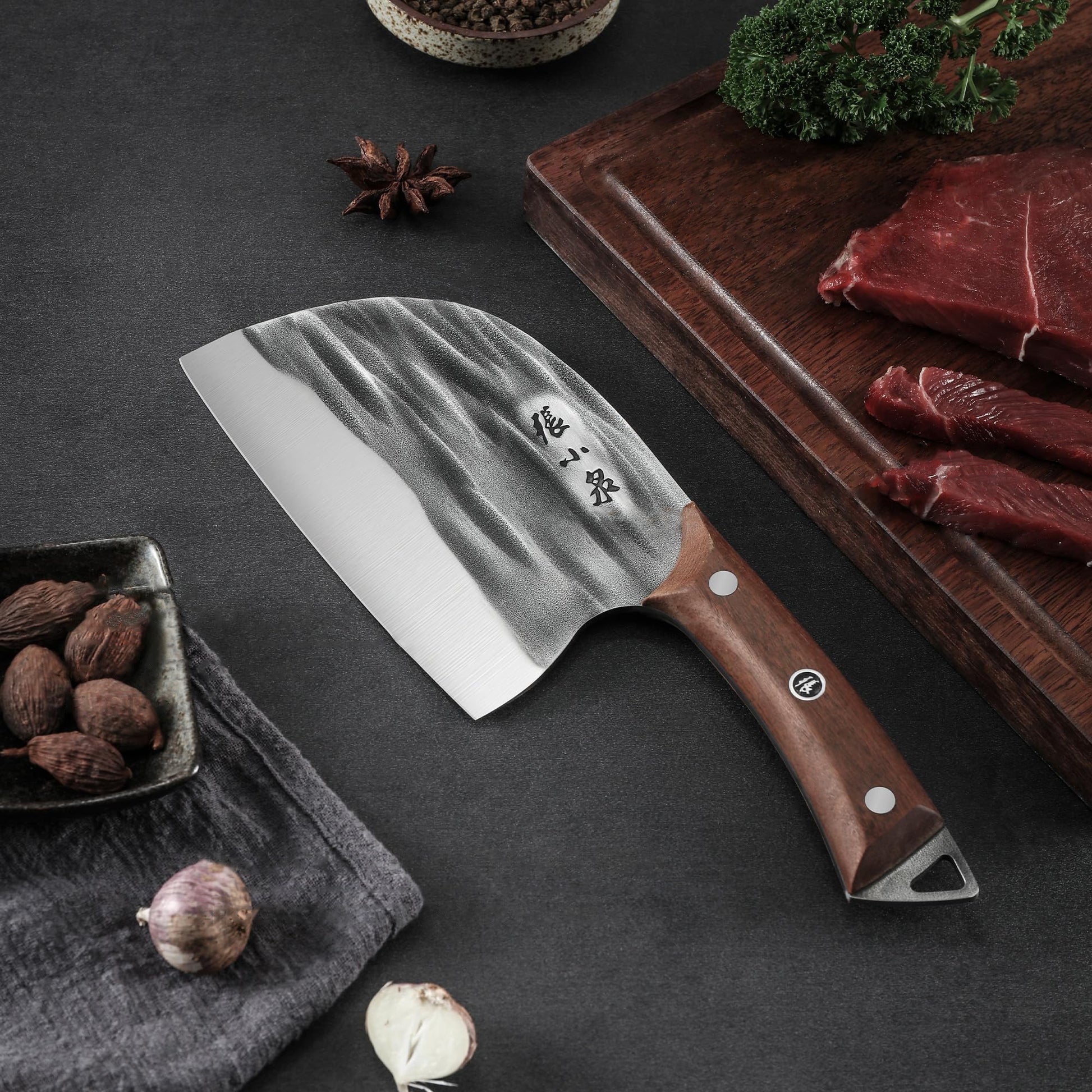 50Cr15MoV hand-forged knife with a wooden handle and textured steel blade, placed on a cutting board with raw meat and spices.