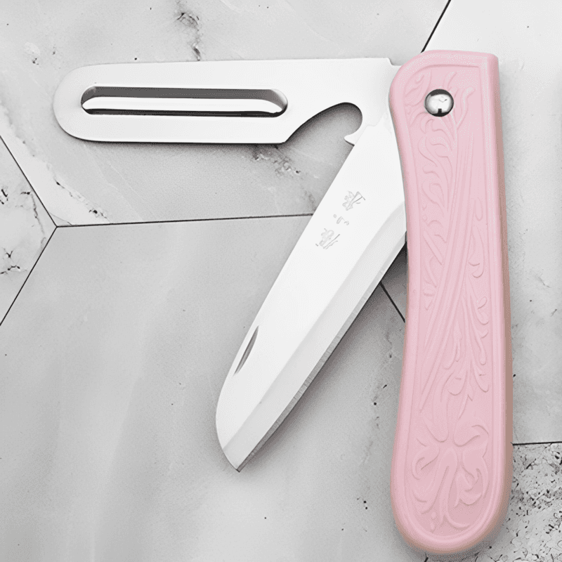 Foldable paring knife with 175mm stainless steel peeling blade and pink handle, ideal for kitchen and travel use.