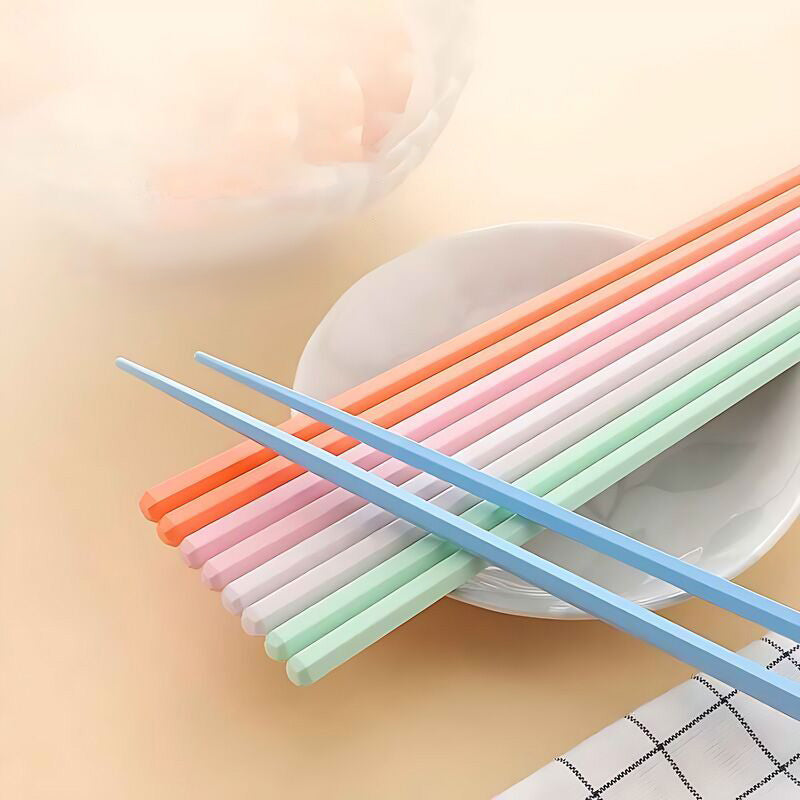 Close-up of colorful PET fiber alloy chopsticks arranged neatly on a table.