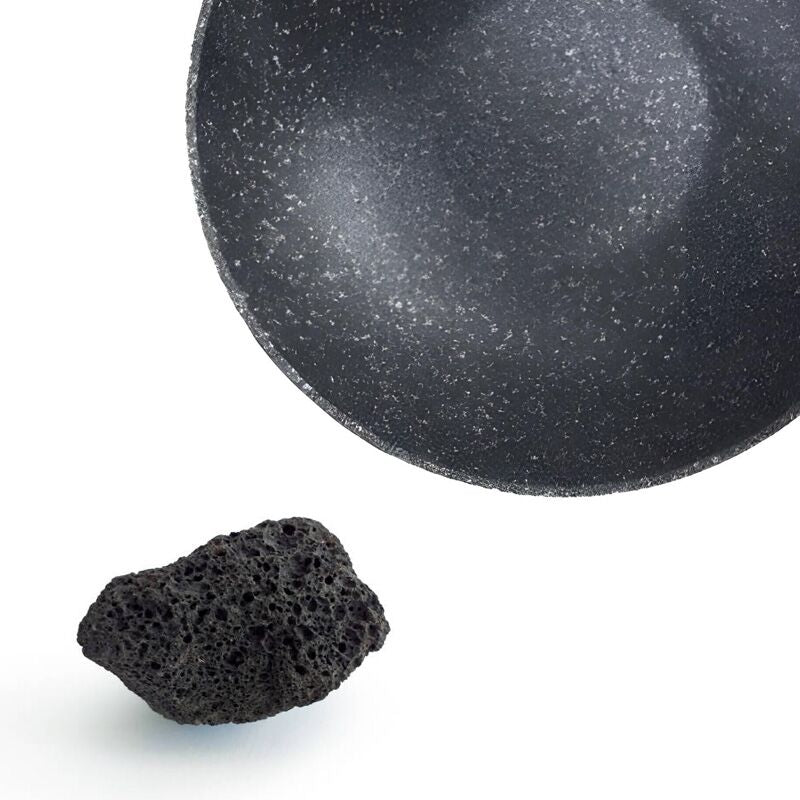 Close-up of volcanic rock wok surface with natural volcanic rock.