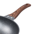 Ergonomic wooden handle of the 32cm non-stick wok pan, stylish and sturdy.