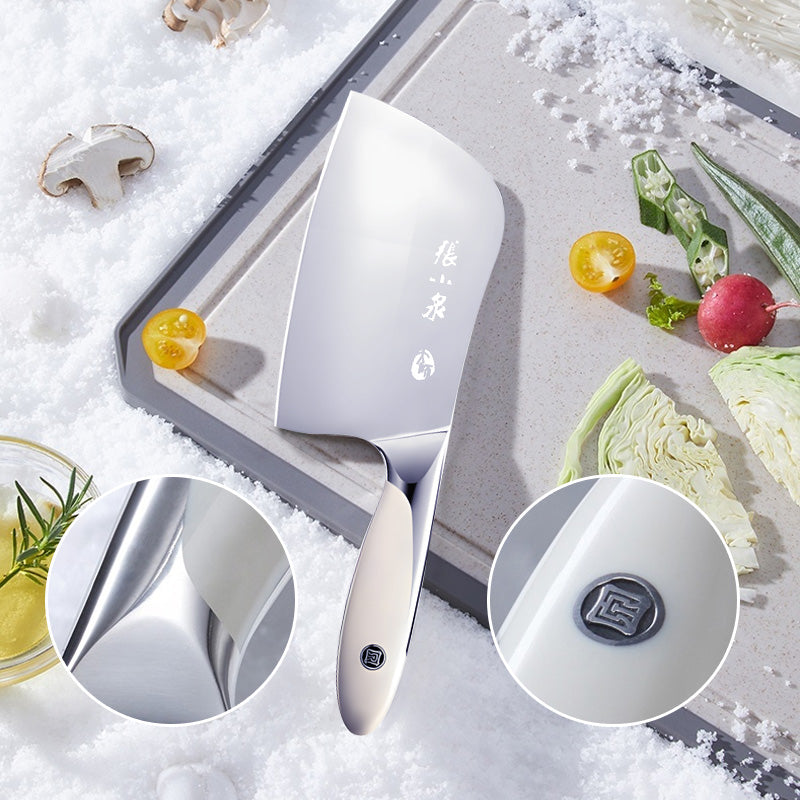 Chinese cleaver displayed on a cutting board with fresh vegetables.