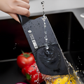 305mm cleaver being rinsed under water, demonstrating its easy-to-clean surface and durable black blade design.