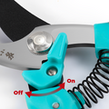 Detailed view of pruning shears' locking mechanism and spring design.